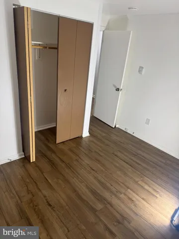 an empty room with wooden floor