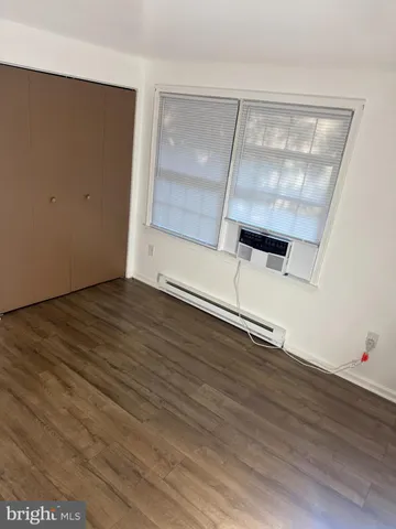 a view of a house with yard and a tree