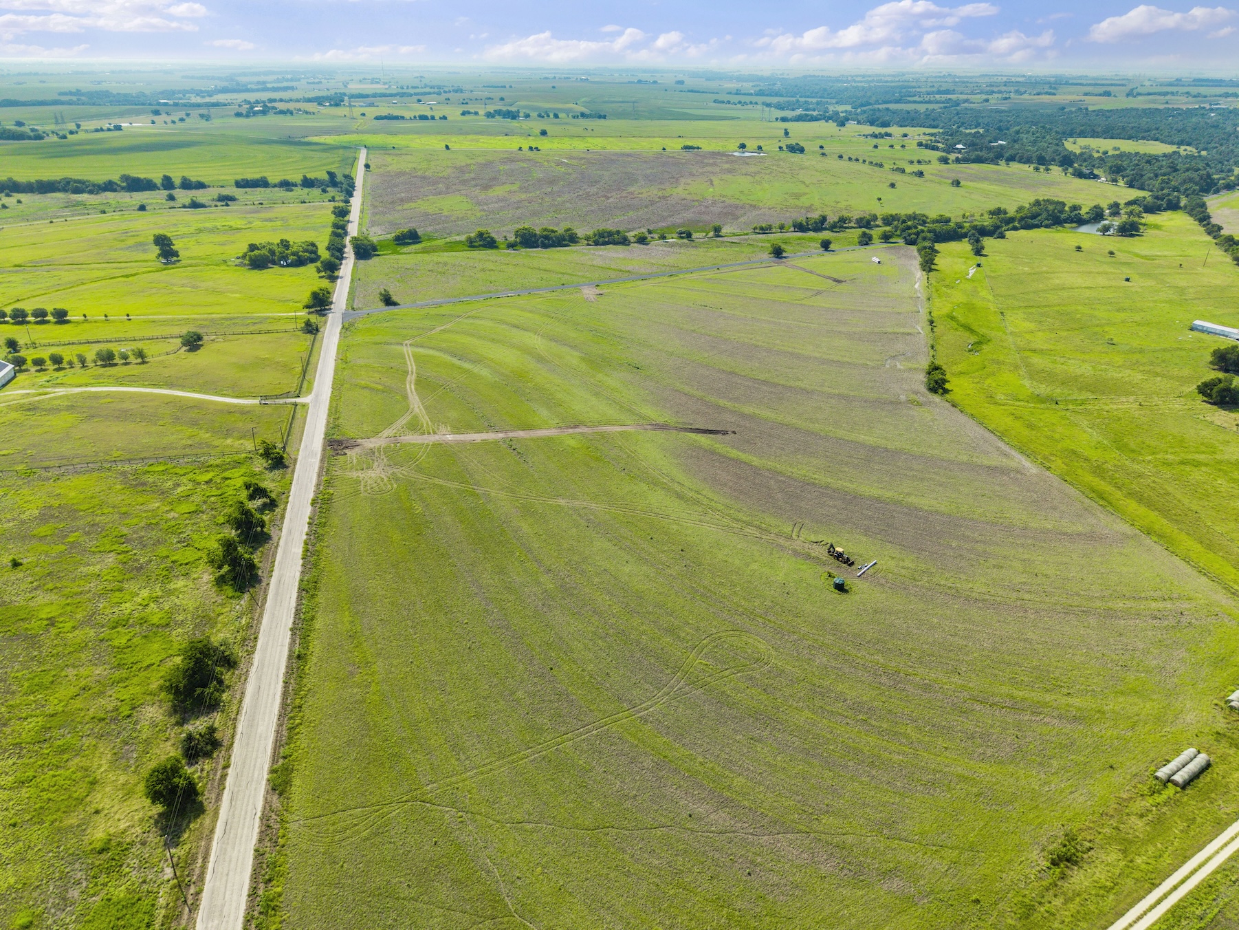 1 County Road 327 Road Granger, TX 76530 - Photo 26 of 27 Vast rolling pastures and mature trees stretch across this expansive countryside acreage.