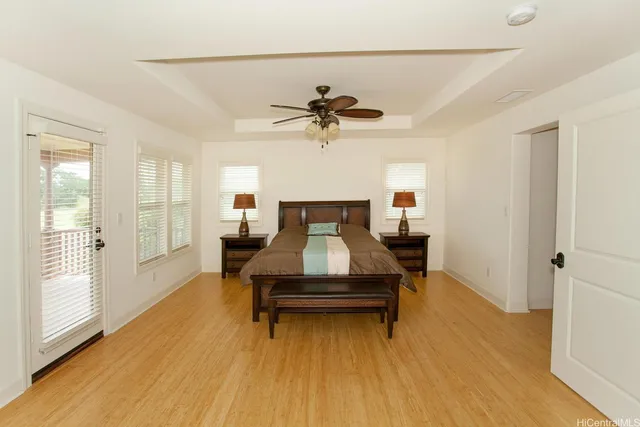a living room with a couch and a chandelier
