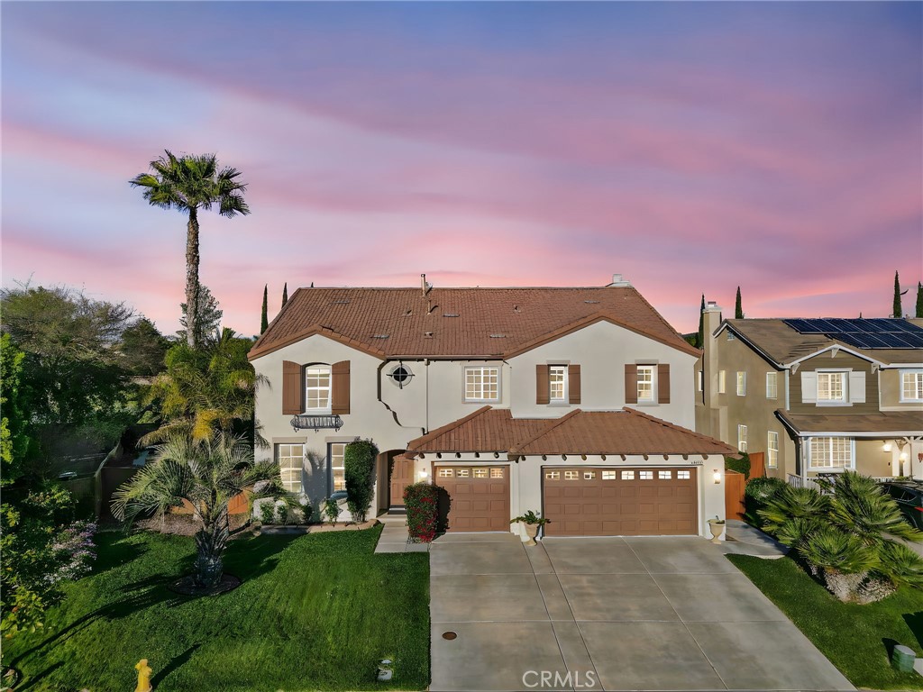 44840 Tudal Street Temecula, CA 92592 - Photo 2 of 35 a front view of a house with a garden and yard