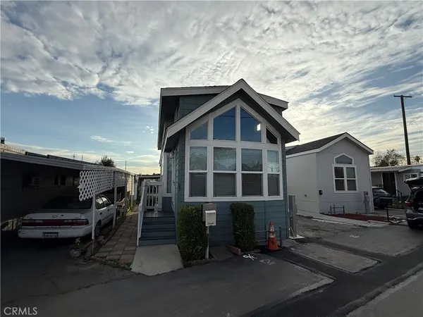 a view of a car park in front of house
