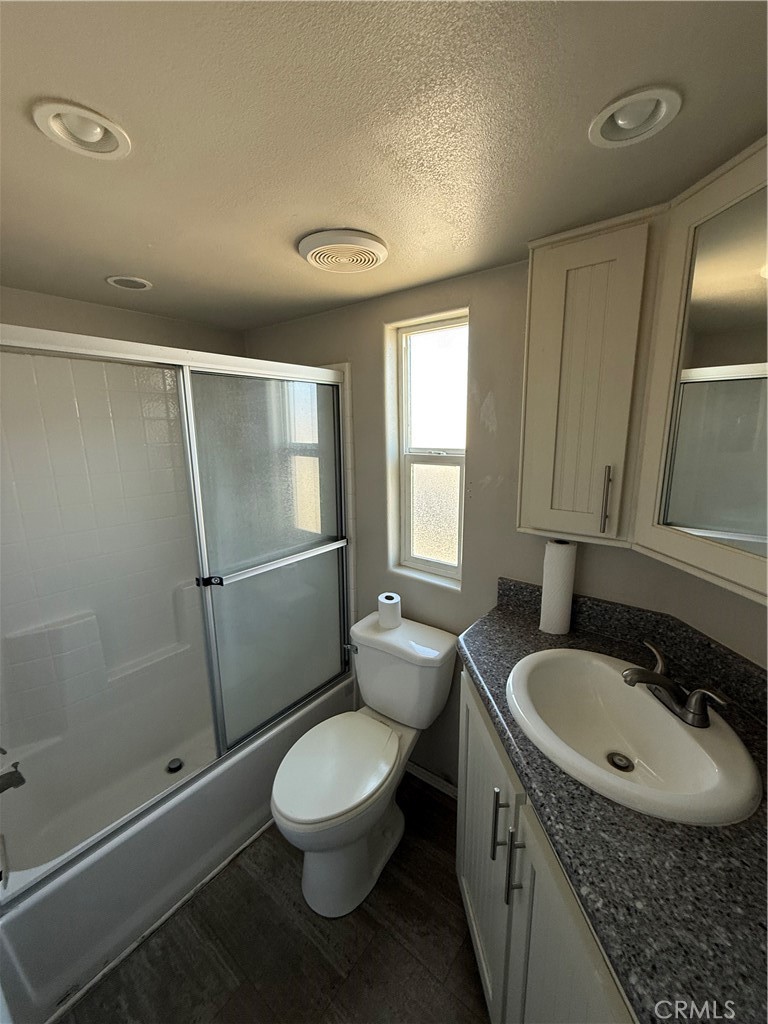 4849 Peck Road, Unit 67 El Monte, CA 91732 - Photo 12 of 13 a bathroom with a sink a toilet and shower