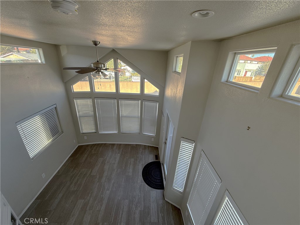 4849 Peck Road, Unit 67 El Monte, CA 91732 - Photo 5 of 13 a view of an empty room with wooden floor and a window