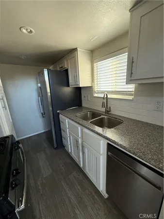a room with cabinets and wooden floor