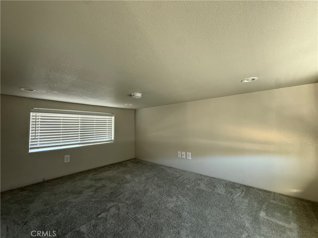 4849 Peck Road, Unit 67 El Monte, CA 91732 - Photo 9 of 13 a view of an empty room with a window