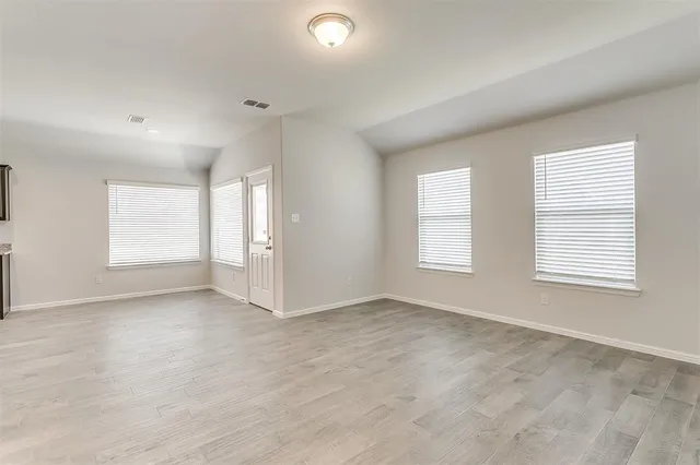 a view of an empty room with a window