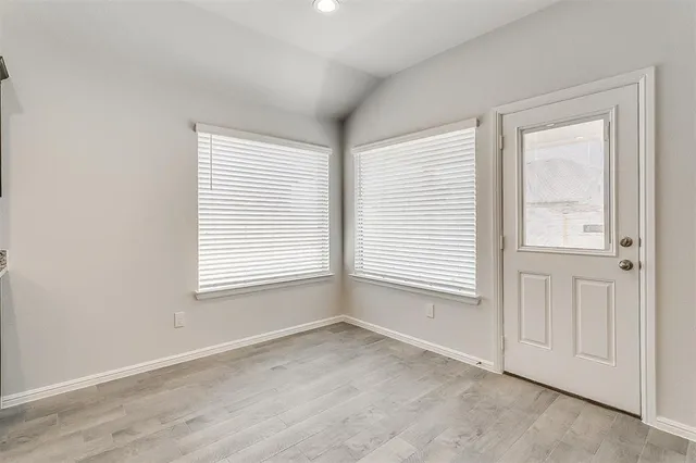 a view of an empty room with a window