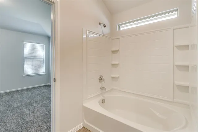 a view of a house with pool and a yard