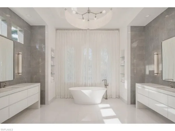 a bathroom with a bathtub and a sink