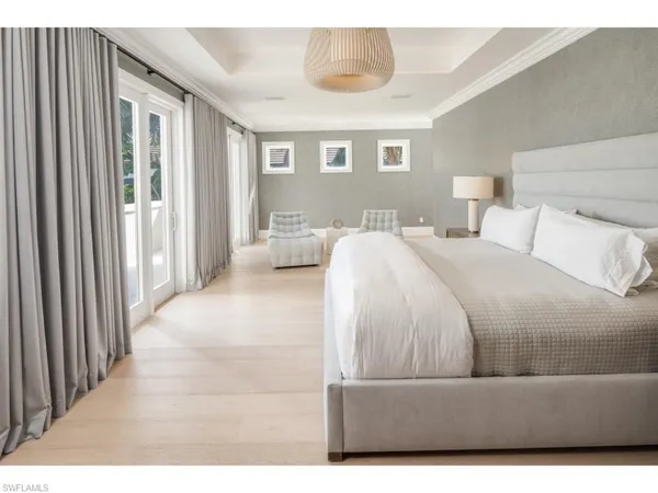 a living room with a bed furniture and a window