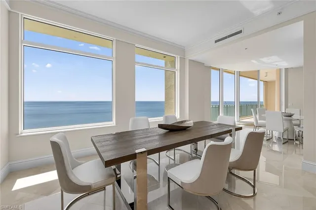 a view of a dining room with furniture and window