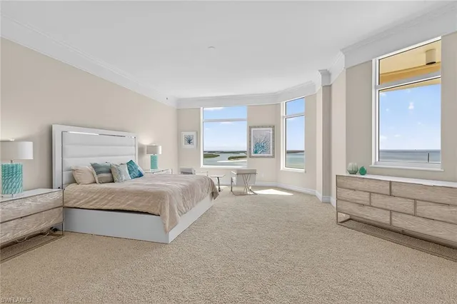 a view of a room that has a bed and a window