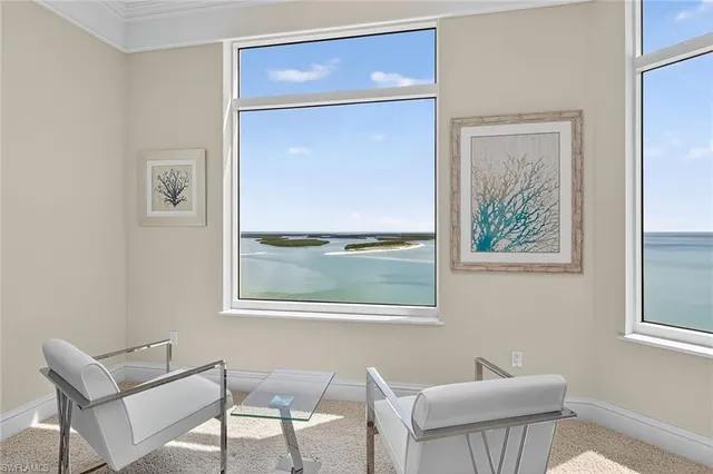 a spacious bedroom with a bed and a large window