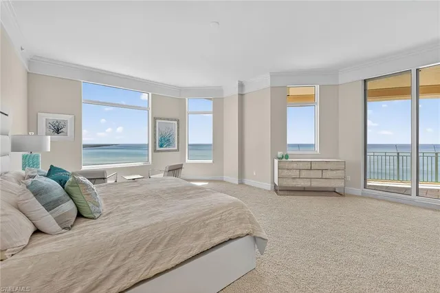 a spacious bathroom with a double vanity sink large mirror and a bathtub