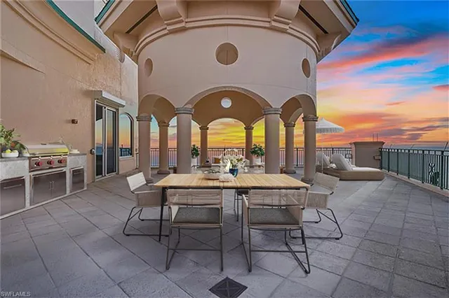 a view of a pathway with a wrought fence