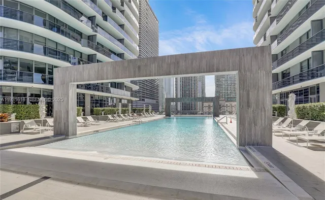 a view of pool with yard