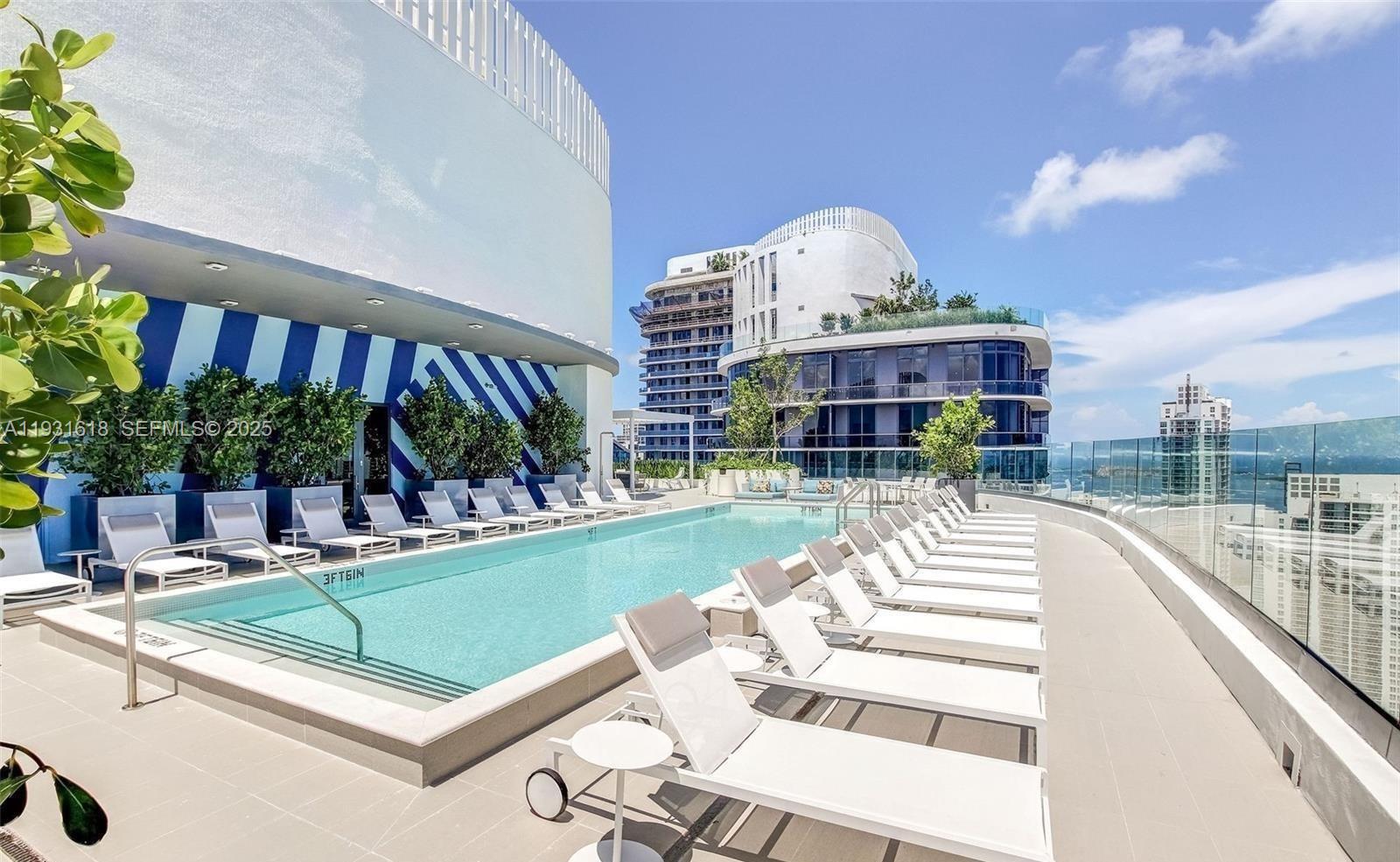 55 Southwest 9th Street, Unit 3707 Miami, FL 33130 - Photo 16 of 25 a view of a patio with couches table and chairs