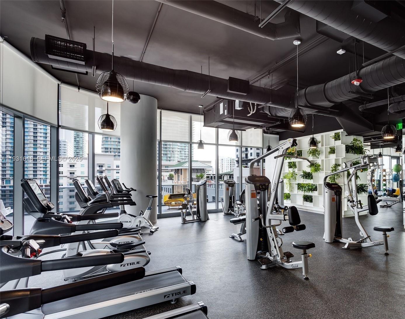 55 Southwest 9th Street, Unit 3707 Miami, FL 33130 - Photo 17 of 25 a view of a room with gym equipment