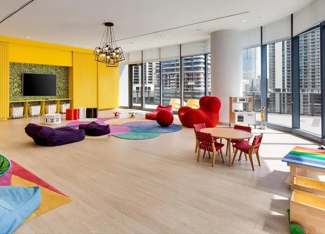 a outdoor living space with furniture and a flat screen tv