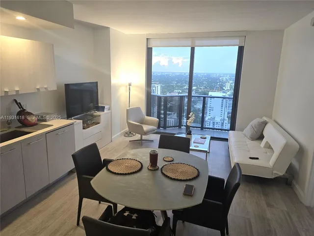 a living room with furniture and a table