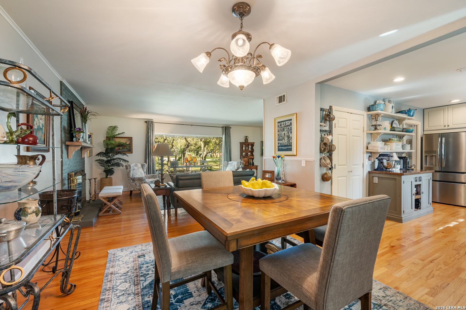 114 Wagon Trail Road Shavano Park, TX 78231 - Photo 13 of 36 a view of a dining room with furniture and wooden floor