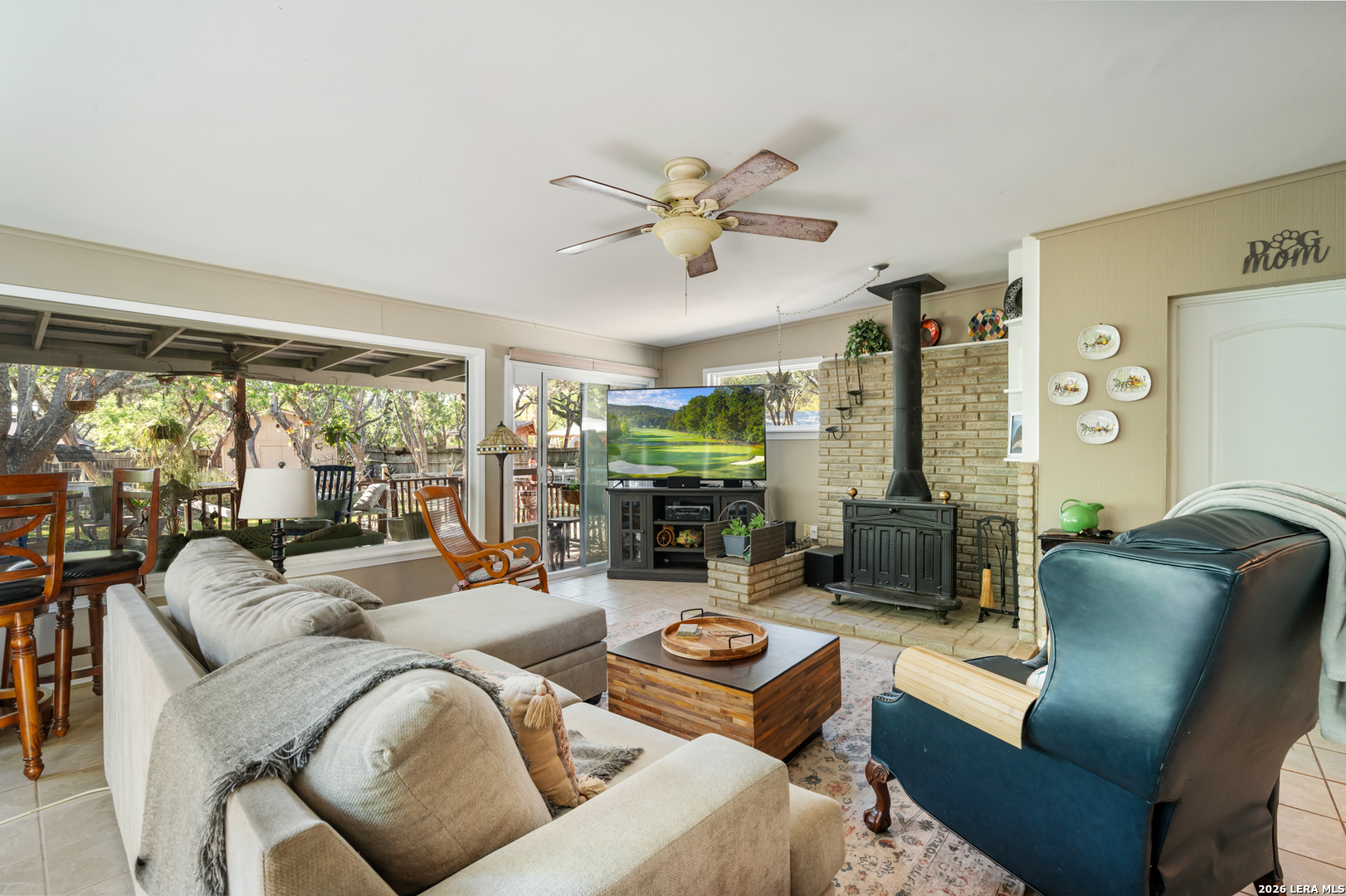 114 Wagon Trail Road Shavano Park, TX 78231 - Photo 20 of 36 a living room with furniture ceiling fan and a large window