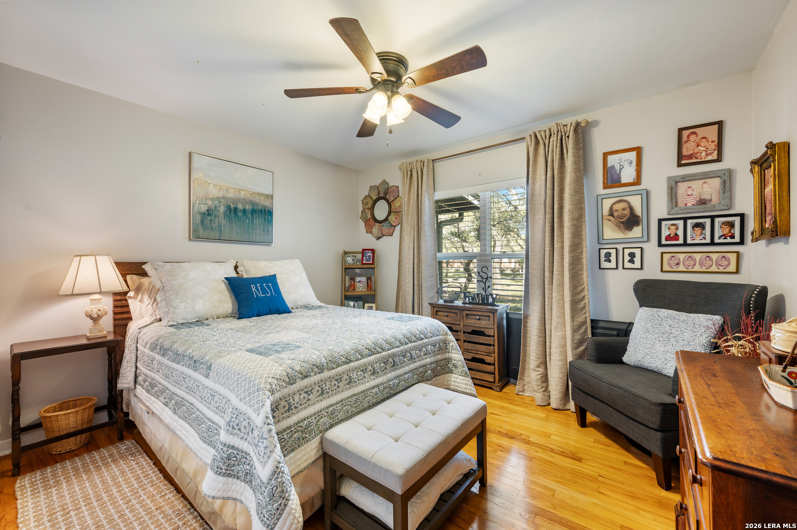 114 Wagon Trail Road Shavano Park, TX 78231 - Photo 21 of 36 a bedroom with a bed and wooden floor