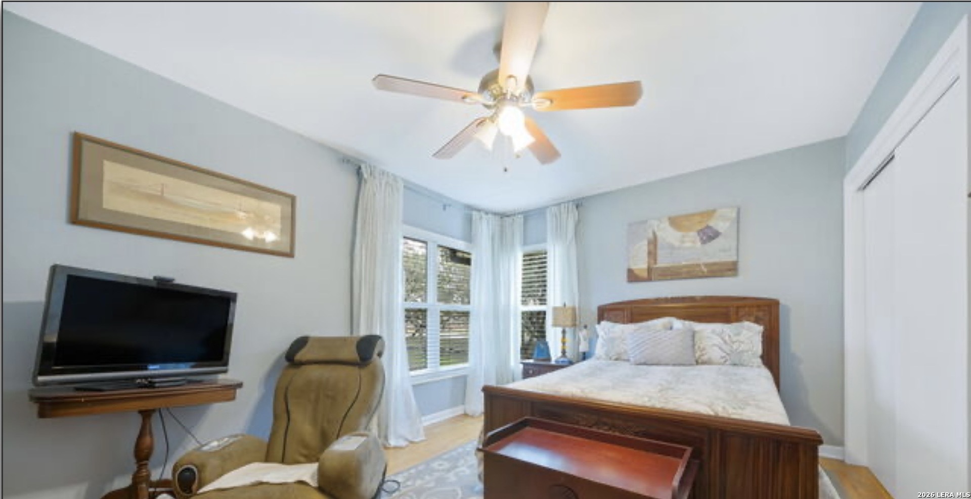 114 Wagon Trail Road Shavano Park, TX 78231 - Photo 22 of 36 a bedroom with furniture and a flat screen tv