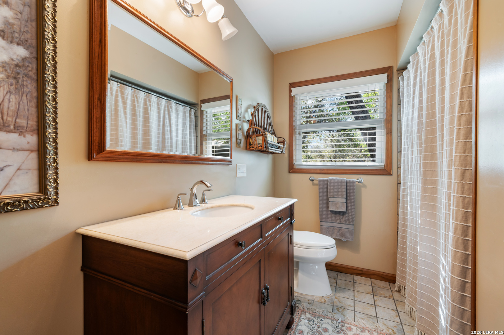 114 Wagon Trail Road Shavano Park, TX 78231 - Photo 23 of 36 a bathroom with a sink and a toilet