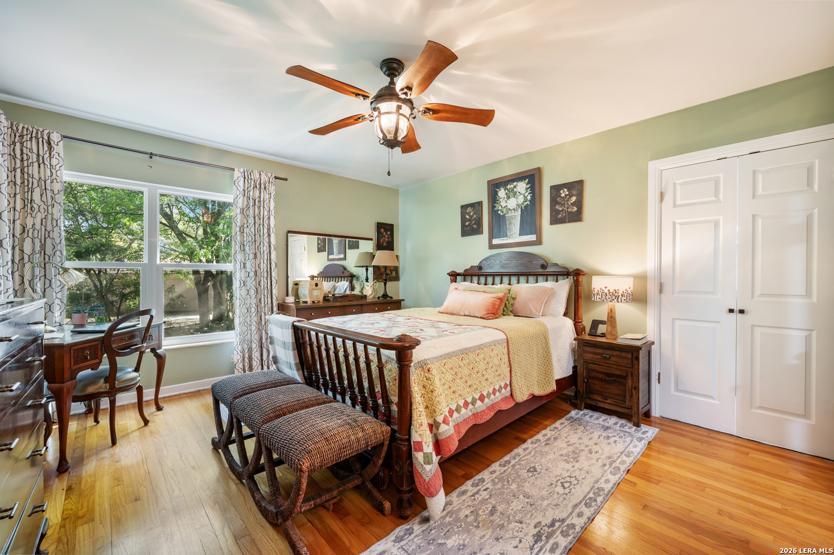 114 Wagon Trail Road Shavano Park, TX 78231 - Photo 24 of 36 a bedroom with a bed and a chandelier