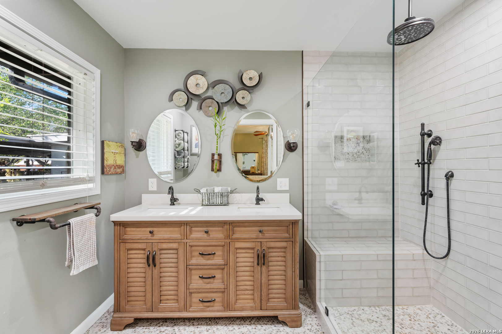 114 Wagon Trail Road Shavano Park, TX 78231 - Photo 25 of 36 a bathroom with a granite countertop sink a mirror and shower