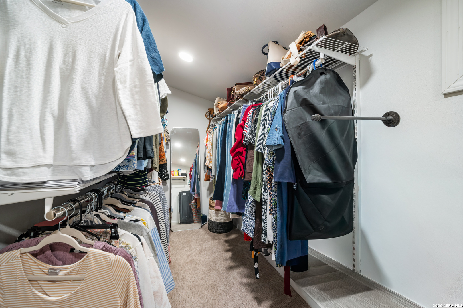 114 Wagon Trail Road Shavano Park, TX 78231 - Photo 28 of 36 a view of walk in closet with clothes and shoes
