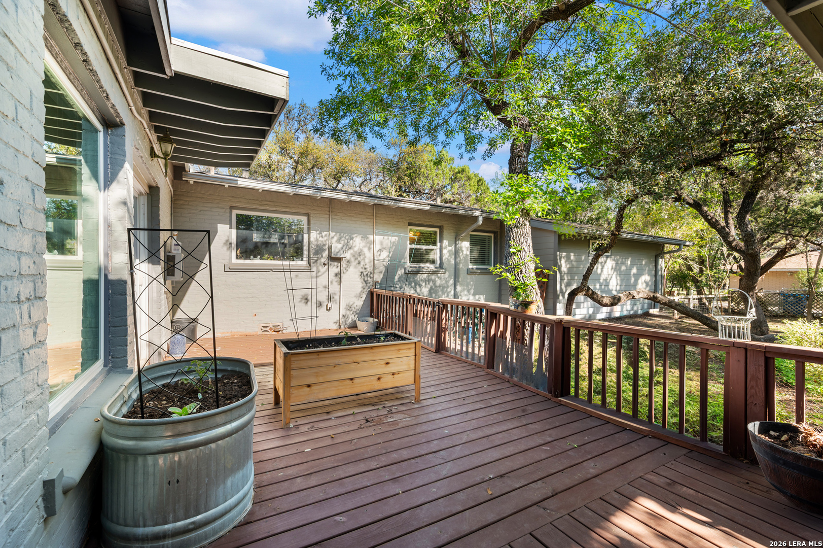 114 Wagon Trail Road Shavano Park, TX 78231 - Photo 30 of 36 a view of a deck with wooden floor and fence