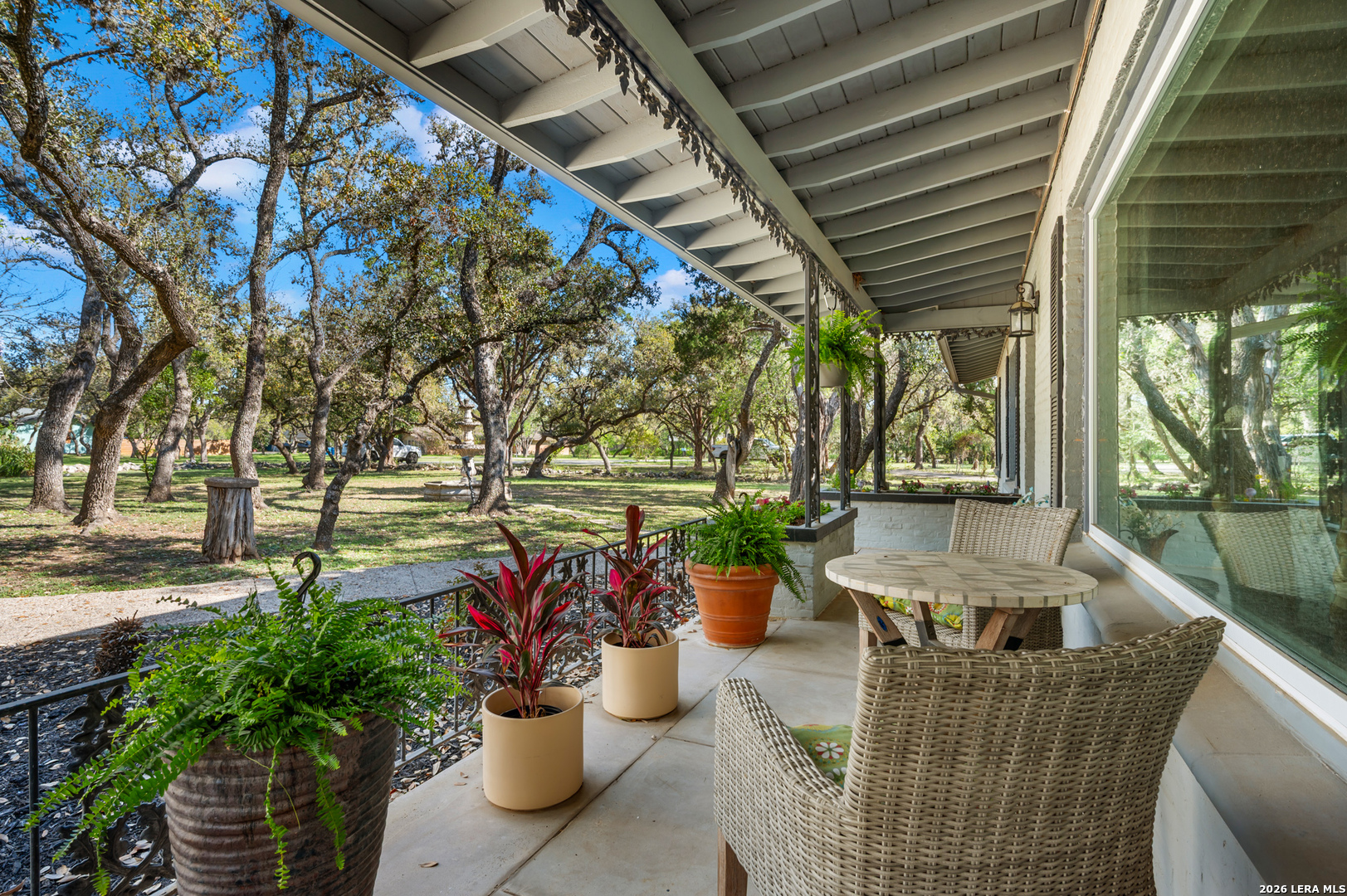 114 Wagon Trail Road Shavano Park, TX 78231 - Photo 6 of 36 a view of a patio with couches and potted plants