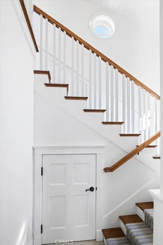 a bed room with a bed and a chair