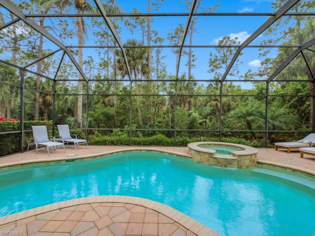 a view of a swimming pool with a yard