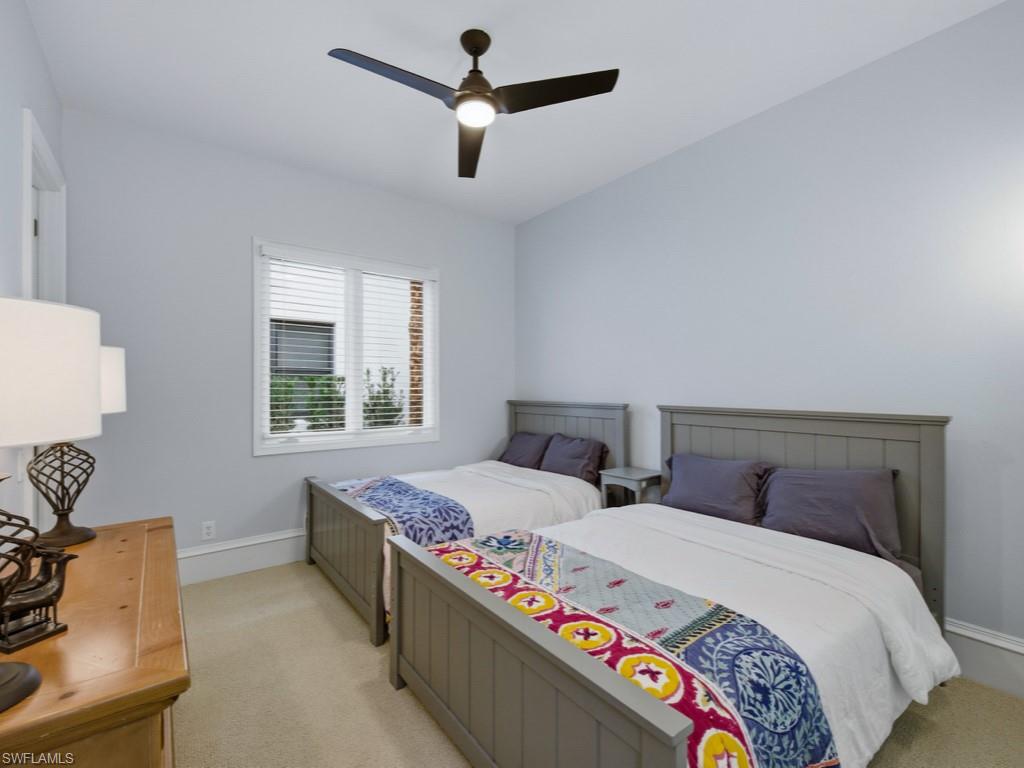18091 Lagos Way Naples, FL 34110 - Photo 15 of 50 a bedroom with bed and window
