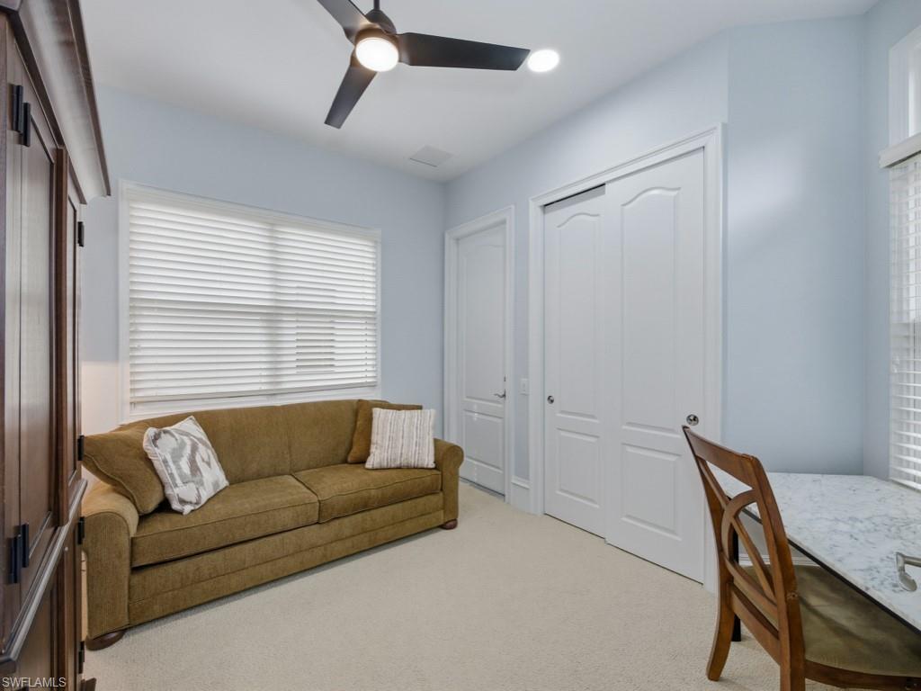 18091 Lagos Way Naples, FL 34110 - Photo 18 of 50 a living room with furniture and a window