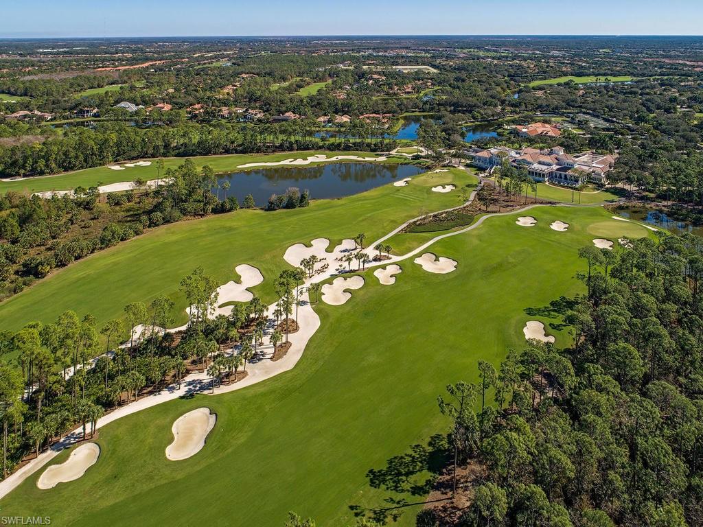 18091 Lagos Way Naples, FL 34110 - Photo 25 of 50 an aerial view of a houses with a lake