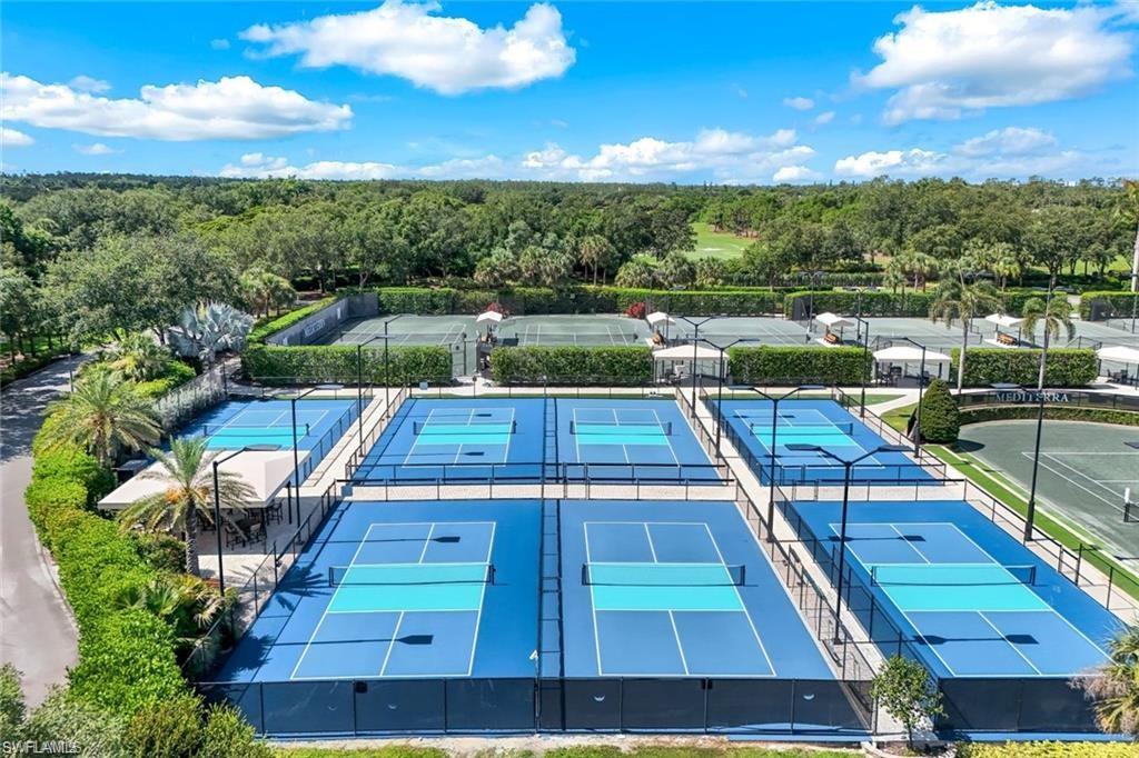 18091 Lagos Way Naples, FL 34110 - Photo 29 of 50 a view of a tennis court
