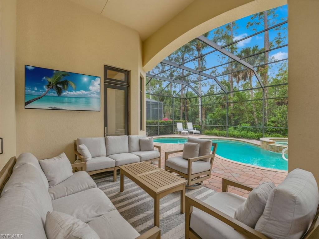 18091 Lagos Way Naples, FL 34110 - Photo 3 of 50 a living room with a couch and chairs