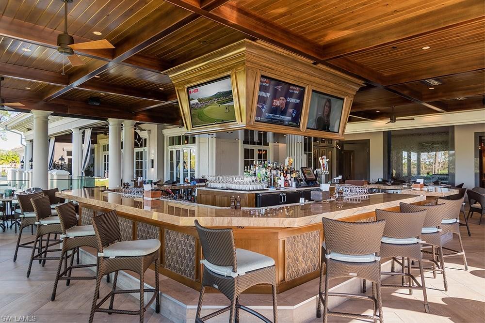 18091 Lagos Way Naples, FL 34110 - Photo 33 of 50 a view of a dinning table and chairs in the patio
