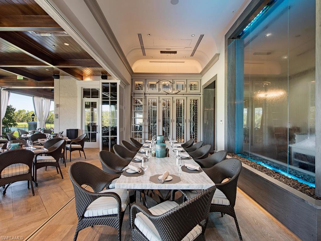 18091 Lagos Way Naples, FL 34110 - Photo 34 of 50 a view of a dining room with furniture window and outside view