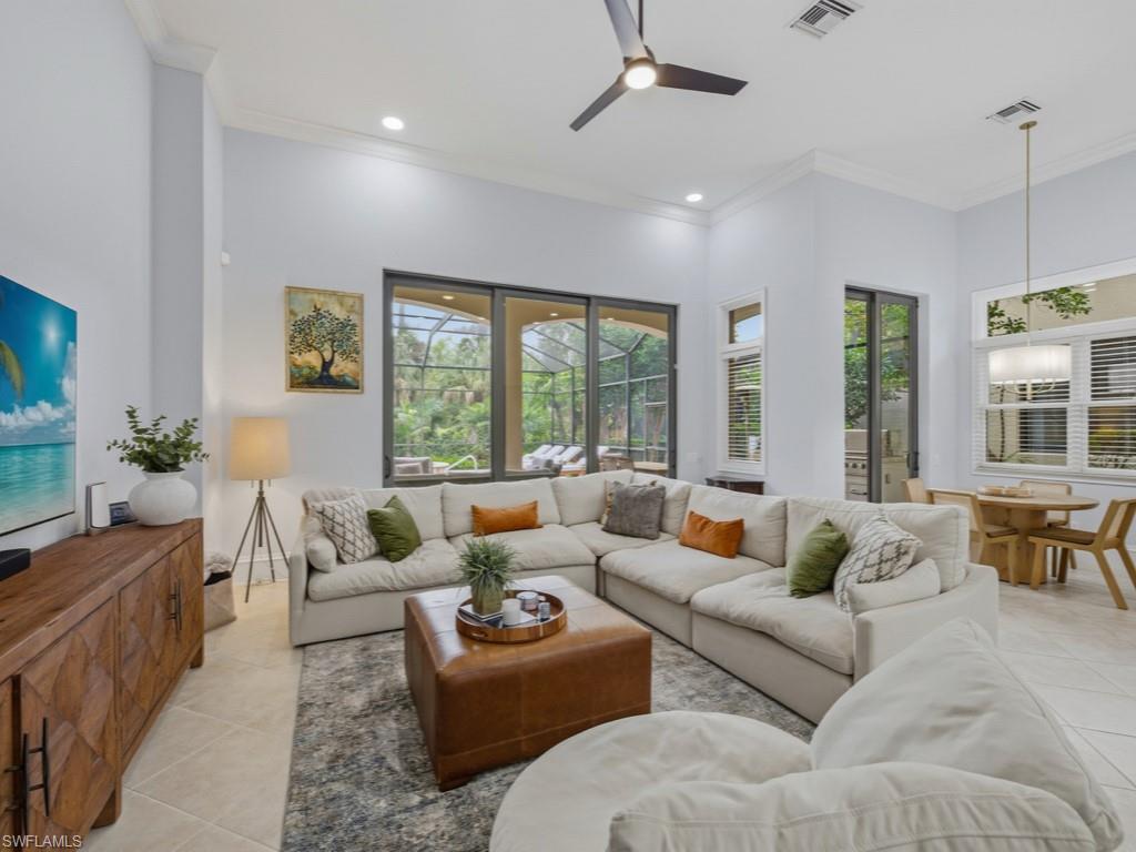 18091 Lagos Way Naples, FL 34110 - Photo 8 of 50 a living room with furniture and a large window