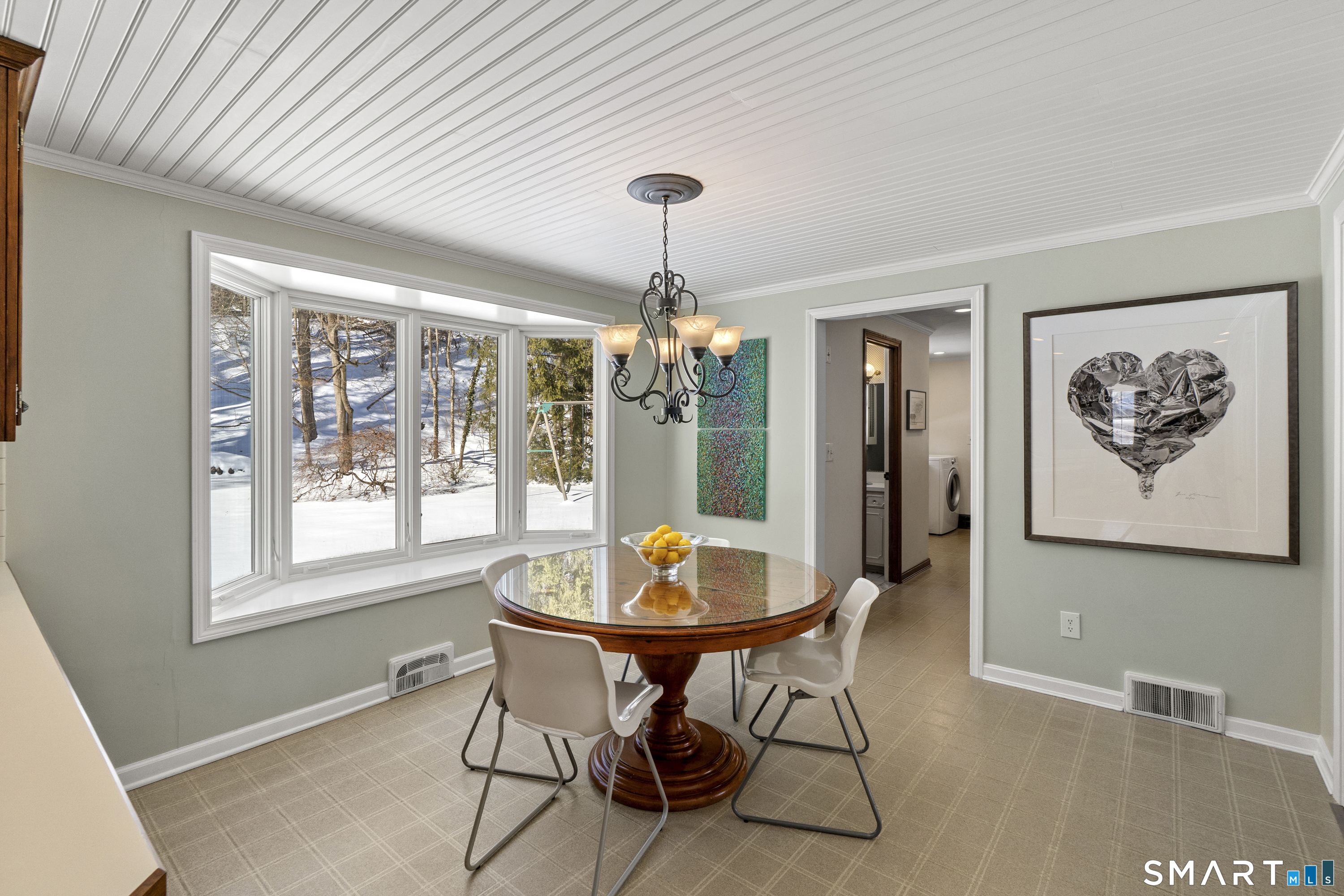 60 Berwyn Road West Hartford, CT 06117 - Photo 13 of 40 Kitchen leading to mudroom area with pantry, closets, half bath and laundry. The mudroom leads to the back door to covered patio and garage as well.