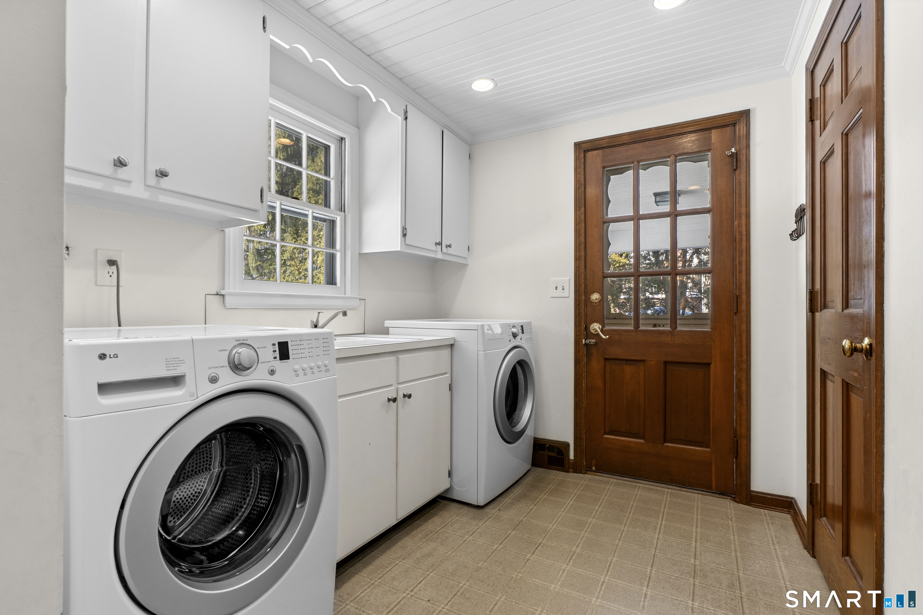 60 Berwyn Road West Hartford, CT 06117 - Photo 15 of 40 Laundry and closets on the first floor. Exterior door to covered patio and access to the attached two car garage