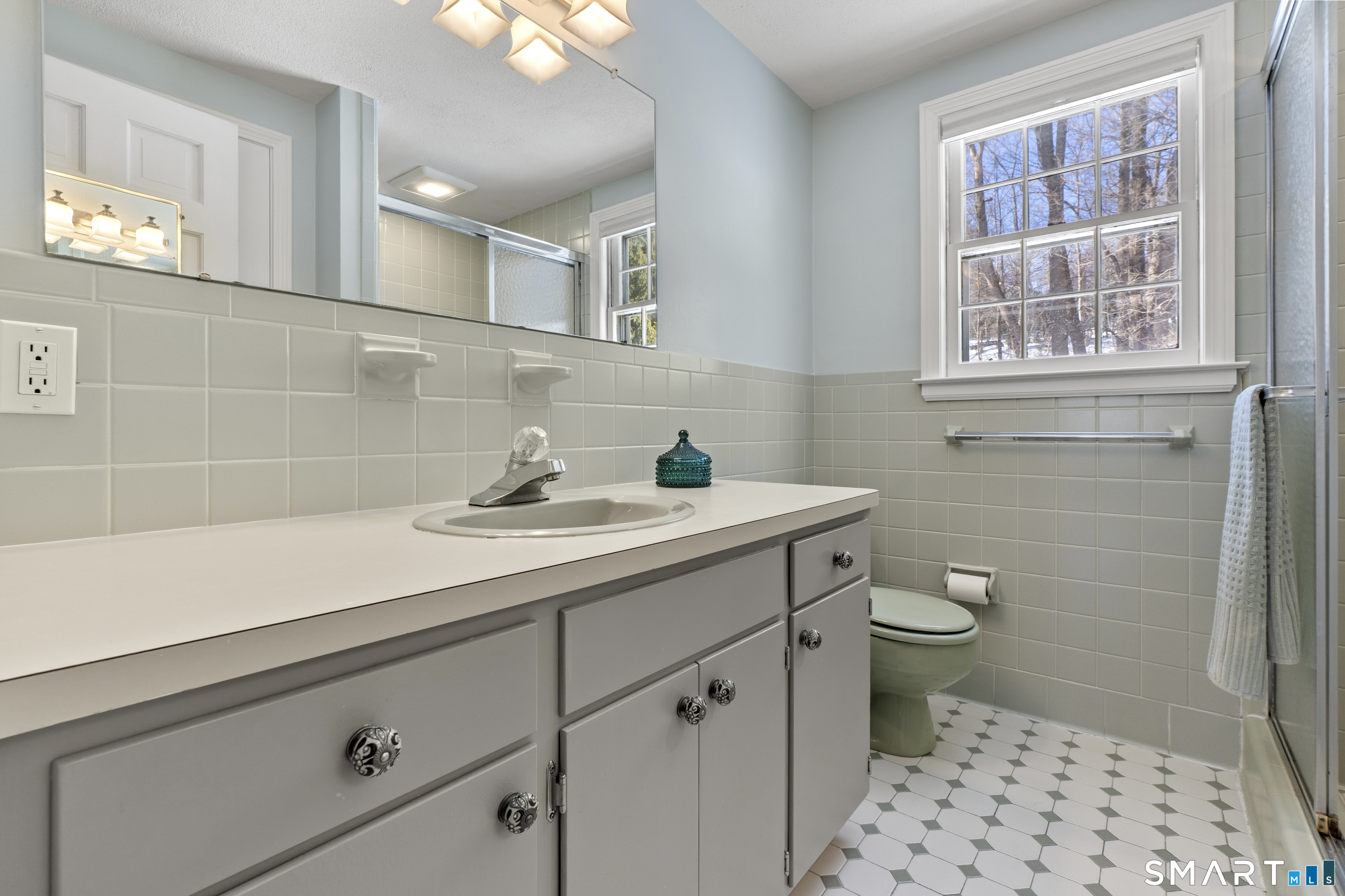 60 Berwyn Road West Hartford, CT 06117 - Photo 22 of 40 Full bathroom in primary bedroom with stall shower and linen closet