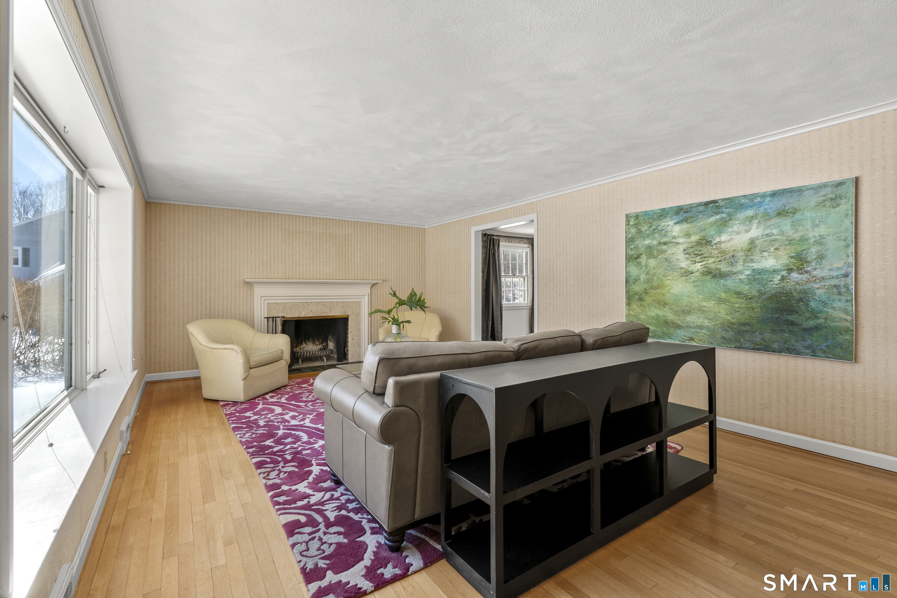 60 Berwyn Road West Hartford, CT 06117 - Photo 4 of 40 Bright and sunny living room with hardwood floors and wood burning fireplace