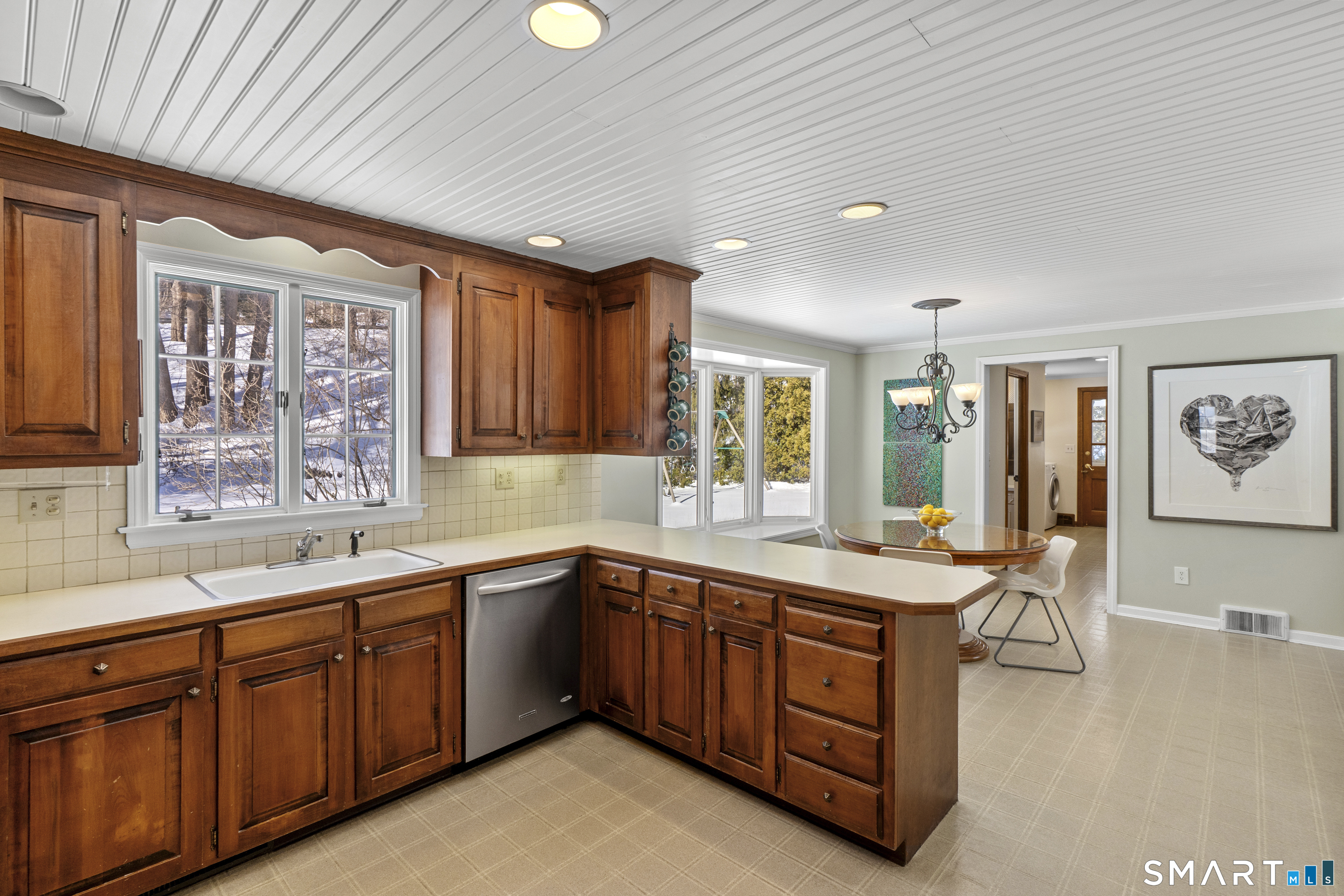 60 Berwyn Road West Hartford, CT 06117 - Photo 9 of 40 Spacious eat in kitchen with bead board ceiling, recessed lighting stainless appliances and mudroom space beyond